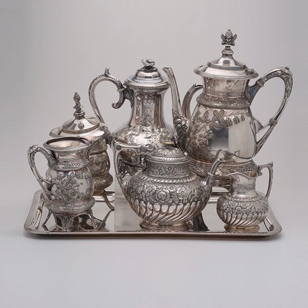 Six Aesthetic Movement Silver Plated Teawares:: Six Aesthetic Movement Silver Plated Teawares: Comprising a Middletown teapot {height 13 1/2 inches}, a creamer, and a covered sugar, all marked 1006; a James Dixon & Sons teapot and creamer; and a Sh