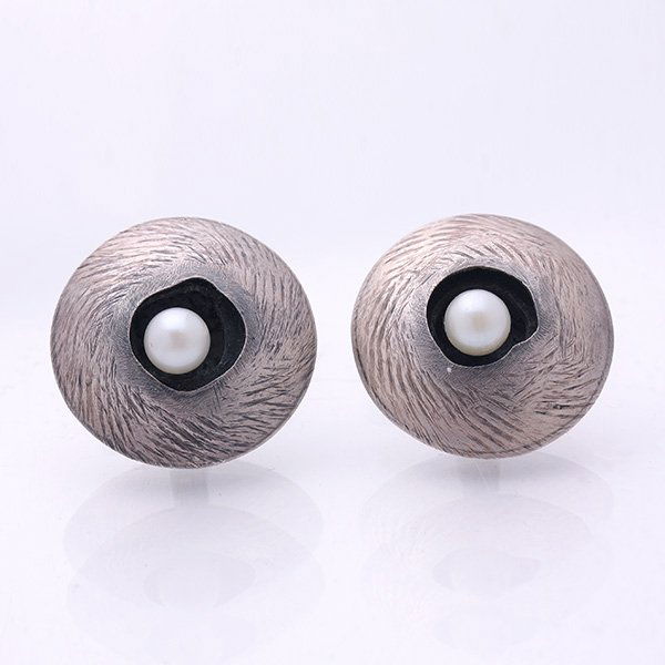 Modernist "Birdnest" Cufflinks. Signed by Peter: Modernist "Birdnest" Cufflinks. The sterling cufflinks bear disc forms resembling bird nests, each completed by a lone pearl "egg." Peter Macchiarini. Signed. c. 1948. Exhibited at Artist's Retrospect
