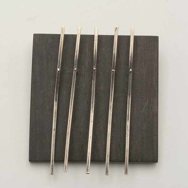 Betty Cooke Pin.: Betty Cooke Pin. Ebonized wood with articulated steriing rods, signed on the back. c.1947. Measures 2 inches square. Exhibited at Walker.