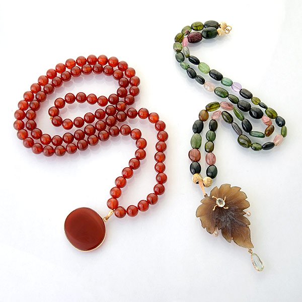 Two Multi-Stone, Yellow Gold Necklaces.: Collection of Two Multi-Stone, Yellow Gold Necklaces. Including one carnelian bead suspending a carnelian disc, 18k yellow gold pendant, forming a 24 inch necklace together with one multicolored tourm