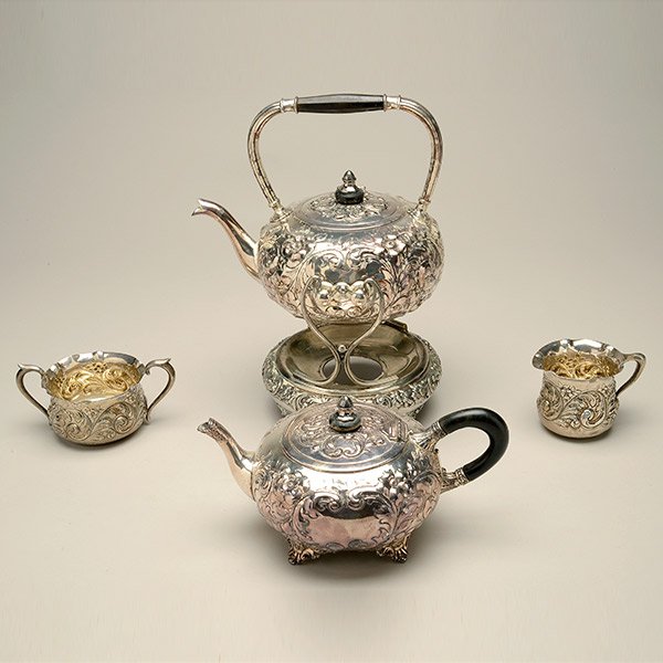 English Plated Kettle and Teapot, Together with a: English Plated Hot Water Kettle on Stand and Teapot, together with a sterling monogrammed creamer and sugar retailed by Shreve {height of kettle on stand 12 1/4 inches; height of creamer 3 inches} [re