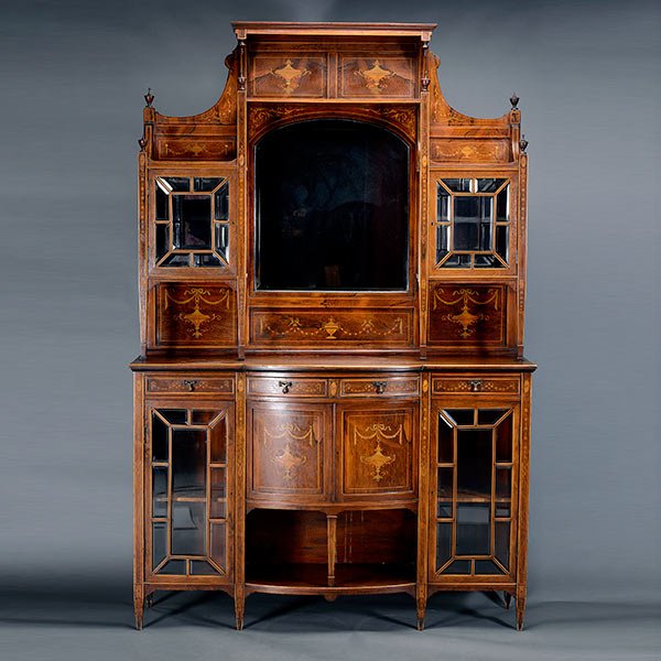 Edwardian Inlaid Adams Style Breakfront: Edwardian Inlaid Rosewood Breakfront in the Adams Taste. The mirrored superstructure centering a recessed arch form beveled mirror paneled shelf over a ribbon-tied garland frieze, surmounted by a gall