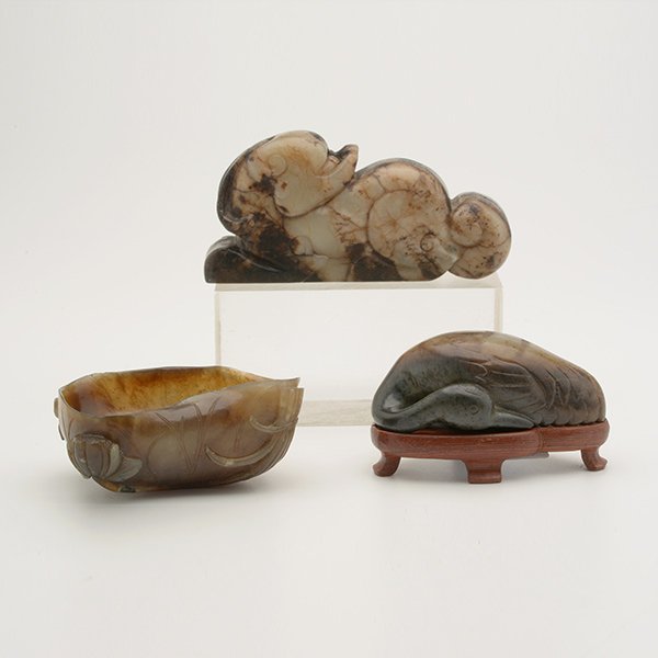 Three Jade Carvings, Ming/Early Qing: Three Jade Carvings Comprising a lotus-form brush washer, a recumbent goose, and a resting chimera. Ming/Early Qing Dynasty Longest: 3 15/16 inches (10 cm) [Minor losses, chips]