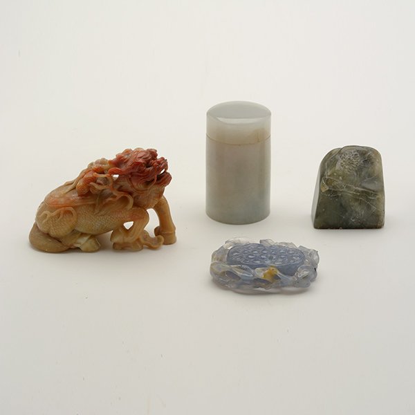 Four Hardstone Carvings, Qing: Four Hardstone Carvings Comprising a soapstone figure of a chimera, an agate pendant, a cylindrical jadeite container, and a soapstone seal. Qing Dynasty Longest: 3 1/8 inches (1.9 cm) [Losses, chips]