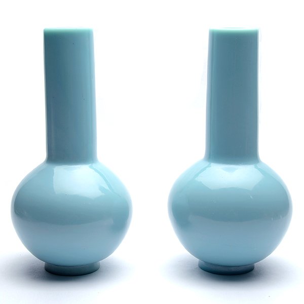 A Pair of Clair-de-Lune Glass Bottle Vases, 18th: A Pair of Clair-de-Lune Glass Bottle Vases Each with a globular body rising to a tall, thick cylindrical neck, raised upon a slightly spreading foot with a recessed base, the opaque glass of a pale sk
