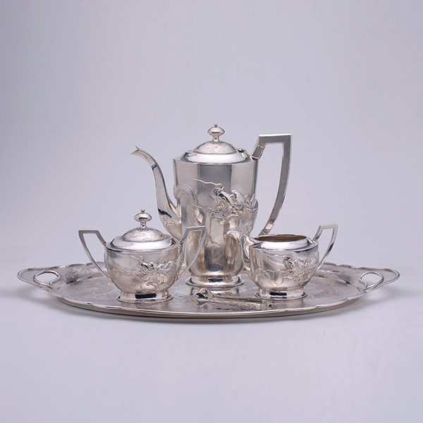 A 5-Piece Chinese Export Sterling Coffee Service,: A Five-Piece Chinese Export Sterling Coffee Service Comprising a coffee pot, creamer, sugar, tongs and tray, each with dragon decoration, stamped marks to the bases, accompanied by original fitted box
