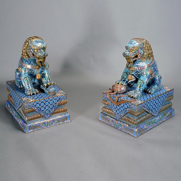 A Pair Large CloisonnÈ Enamel Buddhist Lions, 20th: A Large Pair of CloisonnÈ Enamel Buddhist Lions The lions seated on their rear haunches, the lion's front paw raised over a ball and the lioness's front paw raised over a playful cub, the jaws open r
