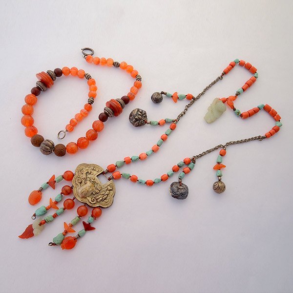 Collection of Two Multi-Stone, Silver, Metal Tribal: *Collection of Two Multi-Stone, Silver, Metal Tribal Necklaces. One is composed of coral, turquoise, carnelian and serpentine beads and amulets accented by silver and metal charms forming a 30 inch ne