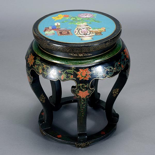A CloisonnÈ Enamel Inset Stool: A CloisonnÈ Enamel Inset Stool The seat inset with a cloisonnÈ panel depicting flowers and antiquities to a turquoise ground, the wood cabriole legs painted with scrolling lotuses against a black gr