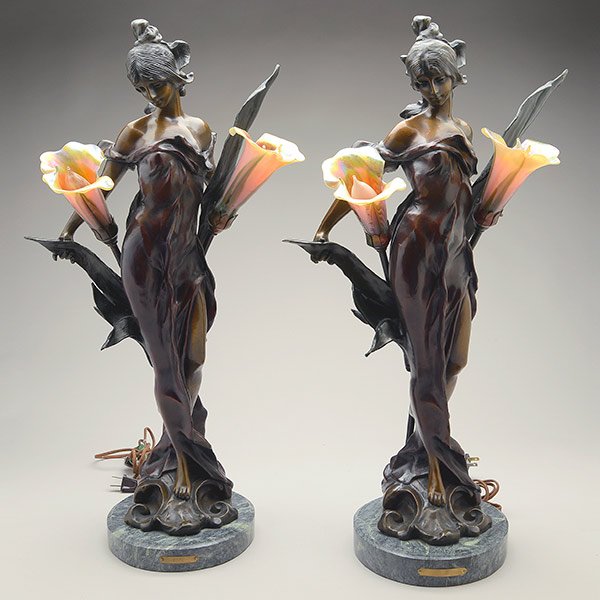 After Pierre Roche, Pair of Art Nouveau Style Bronze: After Pierre Roche (1855-1922), Pair of Art Nouveau Style Bronze Figural Lamps, each fitted with a pair of lily glass shades {Height 27 3/4 inches}