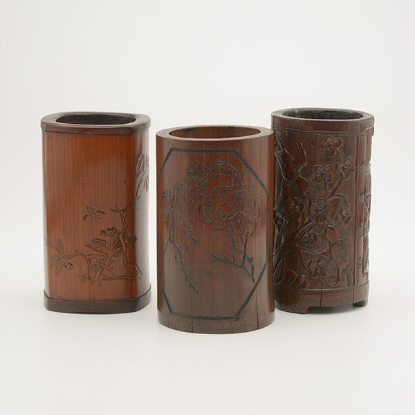 Three Bamboo Brush Pots: Three Bamboo Brush Pots One decorated with an architectural landscape reversed by a bird and prunus; one depicting a squirrel and gapes with an inscription; and one showing insects and flowers with an