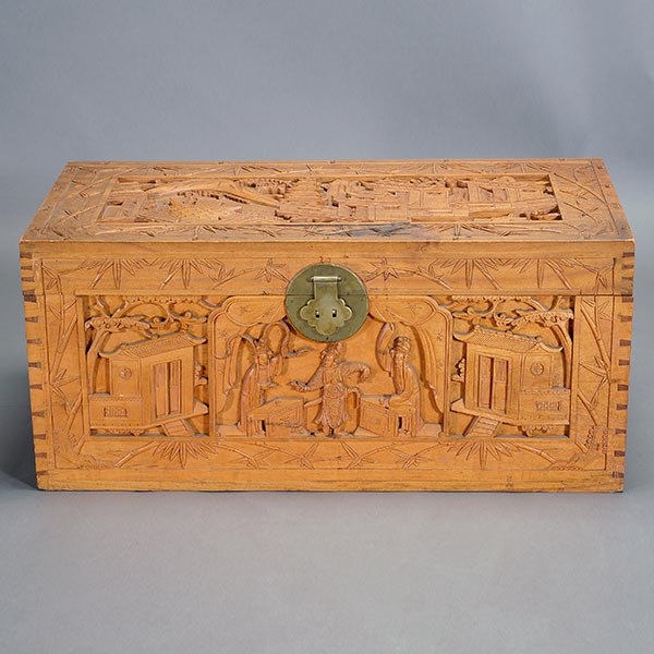 A Carved Camphor Chest: A Carved Camphor Chest {18 x 40 x 20 inches (46 x 102 x 51 cm) approximately} [Stains, small losses and cracks]