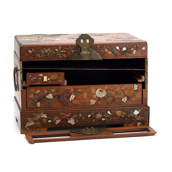 A Hardwood Box with Overlay Embellishments: A Hardwood Box with Overlay Embellishments Overlaid with soapstone and mother-of-pearl decorations depicting a figural landscape to the hinged lid, and with leafy flowers and fruit to the drawers belo