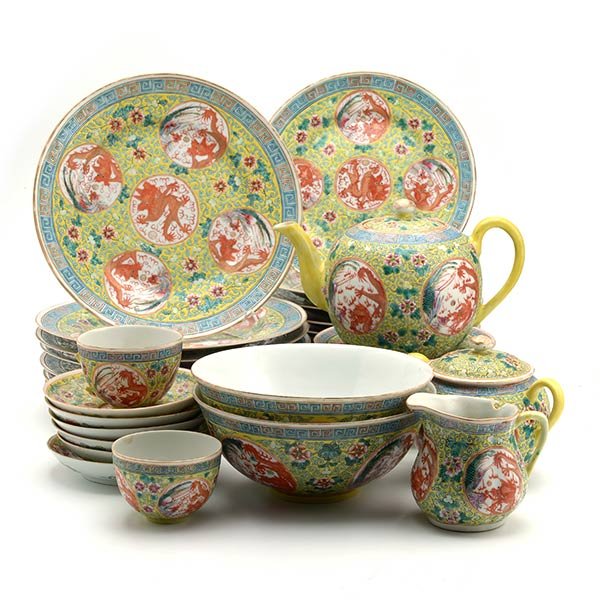 A Large Famille Rose Partial Tea and Dinner Service: A Large Famille Rose Partial Tea and Dinner Service Each decorated with dragon and phoenix medallions against a yellow-ground of scrolling gourds, a six-character mark to each base; comprising several