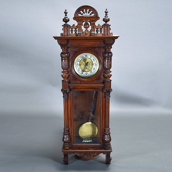 German Becker Walnut Regulator Wall Clock: German Walnut Regulator Wall Clock, The rectangular form with a broken pediment cornice, Corinthian stiles adorsing an arch glazed cabinet, revealing the silver chapter dial with Arabic numerals aroun