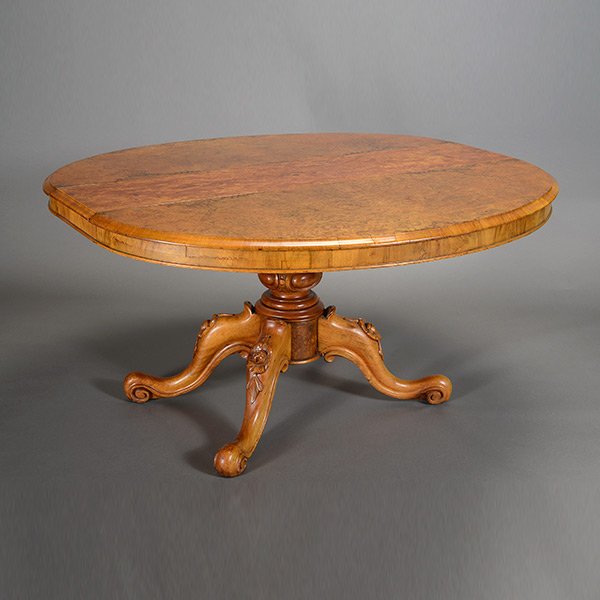 Walnut Burl Wood Oval Dining Table: Victorian Burl Walnut Oval Dining Table, the top with round ends raised on a tripod pedestal base and fitted with three leaves {Dimensions 29 1/2 x 55 x 38 1.2 inches; width of each leaf 11 inches} [b