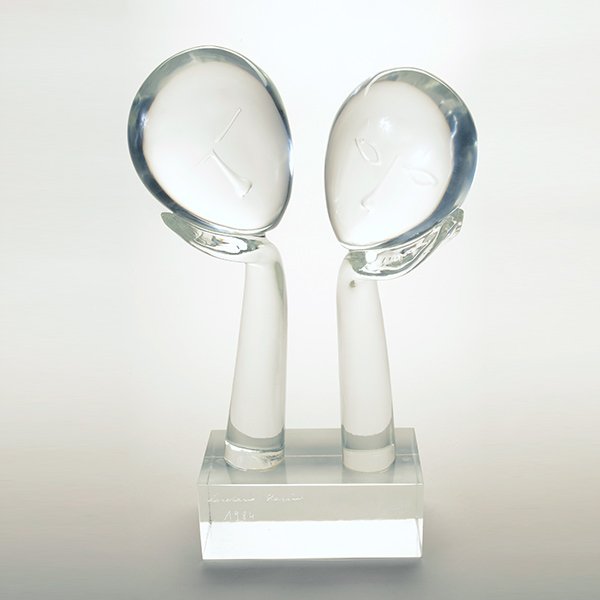 Loredano Rosin, Facce in Cristallo Glass Sculpture: Loredano Rosin (Italian, Born 1948), Amanti Murano Glass Sculpture "Facce in Cristallo", 1984, with light box pedestal stand, and certificate of authenticity {Height of Sculpture 22 1/4 inches; Height