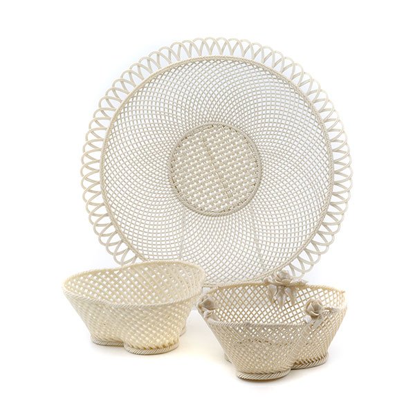 Three Belleek Baskets: Three Belleek Baskets: Comprising one in the form of plate; and two of clover shape, one with encrusted flower decoration {Diameter of plate 10 3/4 inches}