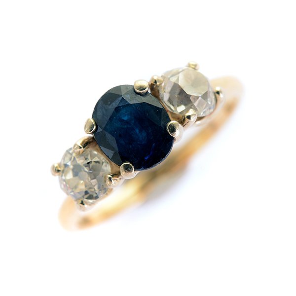 Sapphire, Diamond, 14k Yellow Gold Ring.: Sapphire, Diamond, 14k Yellow Gold Ring. Centering one oval-cut sapphire weighing approximately 0.60 ct., flanked by two old mine-cut diamonds weighing a total of approximately 0.50 cttw., set in a 14