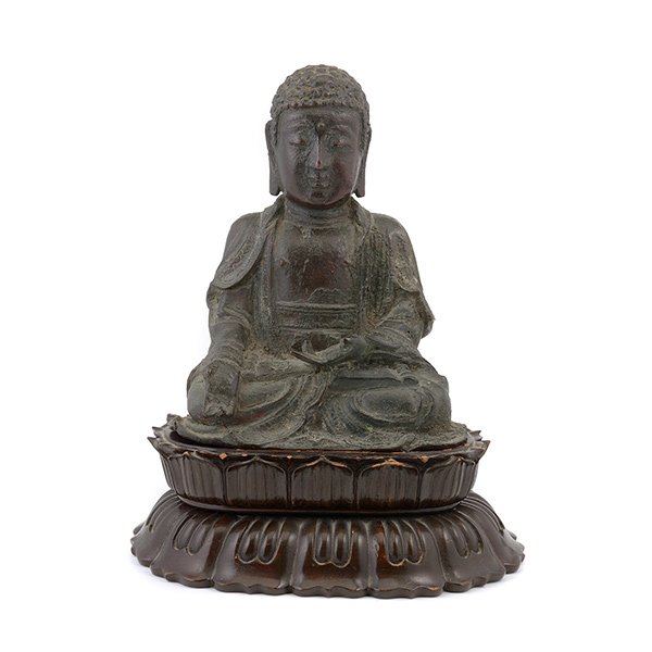 A Japanese Bronze Figure of Buddha, Edo Period: A Japanese Bronze Figure of Buddha Shown seated in meditation while wearing draping robes, with a matching lotus-form wood stand. Edo Period {Height: 7 1/4 inches (18.4 cm) excluding stand} [Losses, c