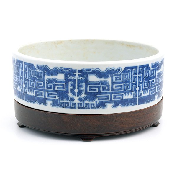 An Underglaze Blue Washer, Yongzheng Mark (19th: An Underglaze Blue Washer The circular vessel painted with stylized opposing phoenixes and scrolling ancient bronze patterns to the exterior, the base bearing a Yongzheng six-character mark within a d