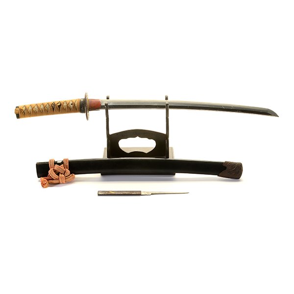 A Wakizashi, Edo Period: A Wakizashi Accompanied by a display stand. Edo Period {Length: 18 inches (45.8 cm) of blade approximately} [Overall wear, several nicks to the blade, cracks and losses to the scabbard]