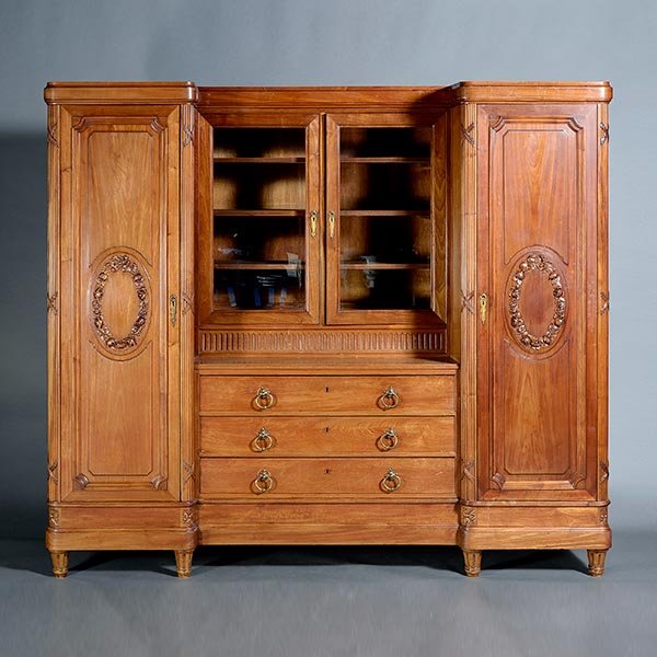 Louis XVI Style Walnut Cabinet.: Louis XVI Style Walnut Cabinet, Composed of three sections: the recessed center of twin glazed doors, over three long drawers fitted with loop drop handles, twin paneled doors centered with ribbon-tie