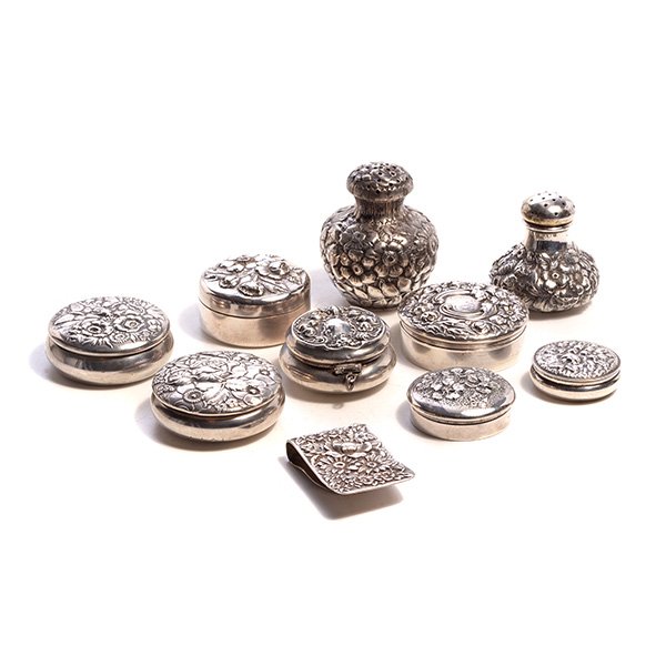 Ten Floral Repousse Sterling Items: Ten Floral Repousse Sterling Items: Comprising seven pill boxes: including three Gorham, one Whiting, one Fesseden & Co, and two others; a Kirk money clip; and two shakers by Shiebler and Wood & Hughe