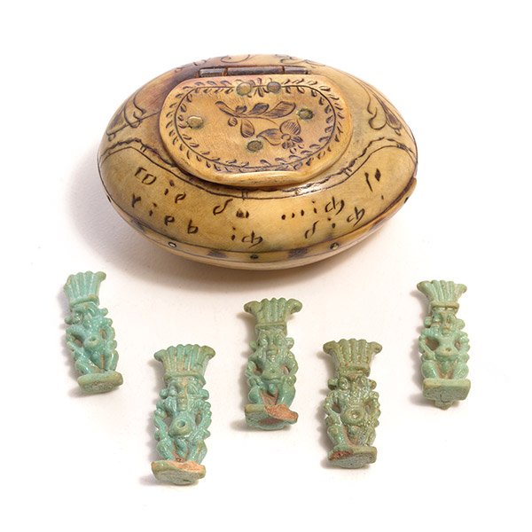 Continental Oval Box and Five Miniature Egyptian: Continental Scrimshaw Oval Box Together with Five Associated Miniature Egyptian Turquoise Faience Figural Amulets {Length of box 2 inches} [losses to hinge of box]