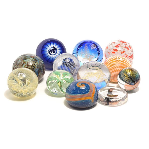 Ten Abstract Paperweights: Ten Abstract Paperweights: Including a Caithness "San Francisco Millenium" weight with encased bubbles, 36/50 {height 2 3/4 inches}; a Michael Nourot blue frosted window encasing white sphere; a two p