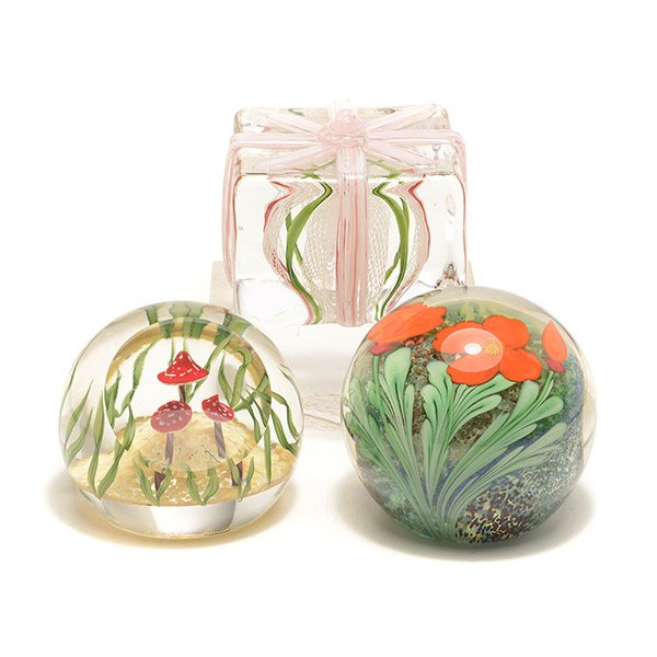 Two Lundberg Studios and One Orient & Flume: Two Lundberg Studios and One Orient & Flume Paperweights: Including a Lundberg "Toadstool Trio", with a certificate and box, 1989, no. 071116; an Orient & Flume poppies paperweight, 1982; and a Lundbe
