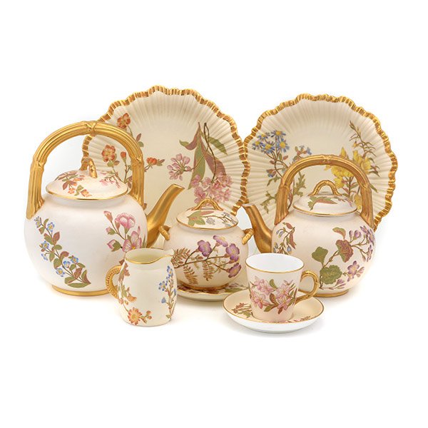 Nine Piece Royal Worcester Associated Tea Service: Royal Worcester Associated Tea Service: Comprising a teapot {height 6 1/2 inches} and a coffee pot {height 8 inches}, both with a gilt branch form handles, a creamer, a covered sugar, coaster, two cak