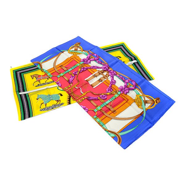Collection of Two Vintage Hermes Silk Scarves.: Collection of Two Vintage Hermes Silk Scarves. Including "Couvertures et Tenues de Jour," 1974, by artist Jacques Eudel, bright yellow ground, green stripe border, 34 1/2 inches square together with "