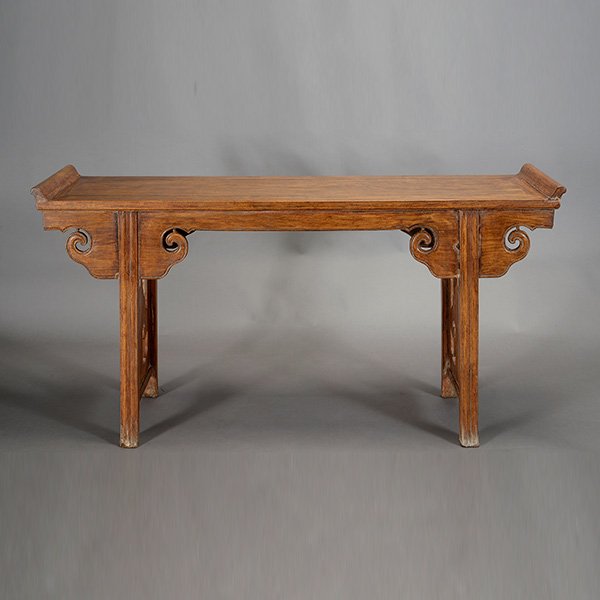 A Hardwood Altar Table: A Hardwood Altar Table Designed with scroll-form spandrels. {64 x 34 x 17 3/4 inches (163 x 86 x 45 cm) approximately} [Overall wear, chips]