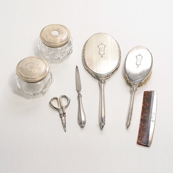 Webster Five Piece Dressing Set and Two Dresser Jars: Webster Five Piece Sterling Silver Dresser Set: Comprising a hand mirror {length 12 3/4 inches}, nail file and scissors, hair brush, and comb; together with two Wallace sterling lidded dresser jars (7