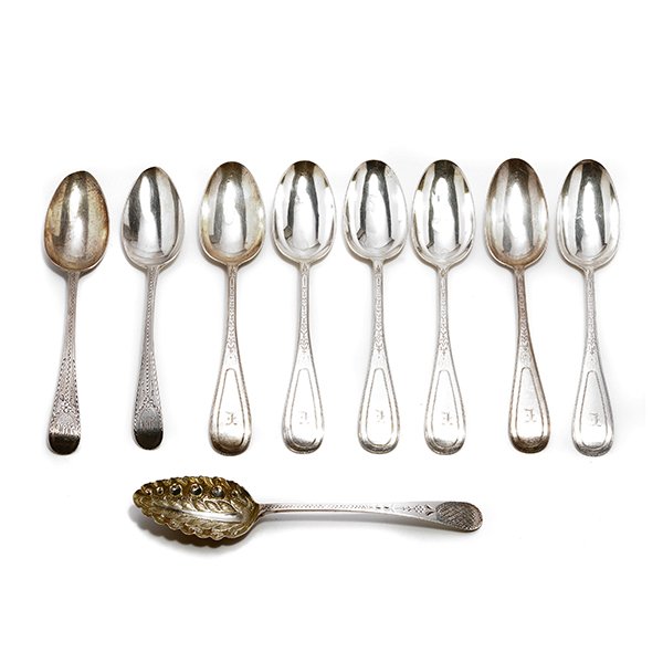 Nine English Silver Spoons: Pair George III Sterling Tablespoons with Bright Cut Engraved Decoration, Samuel Godbehere & Edward Wigan, London, and a Chester Sterling Repousse Berry Spoon, the three late 18th/Early 19th Century; 