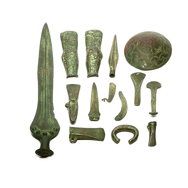 Fifteen Luristan Verdigris Patinated Iron Weapons and: Fifteen Luristan Verdigris Patinated Iron Weapons and Implements {Length of sword 21 1/4 inches; diameter of shield 6 inches}