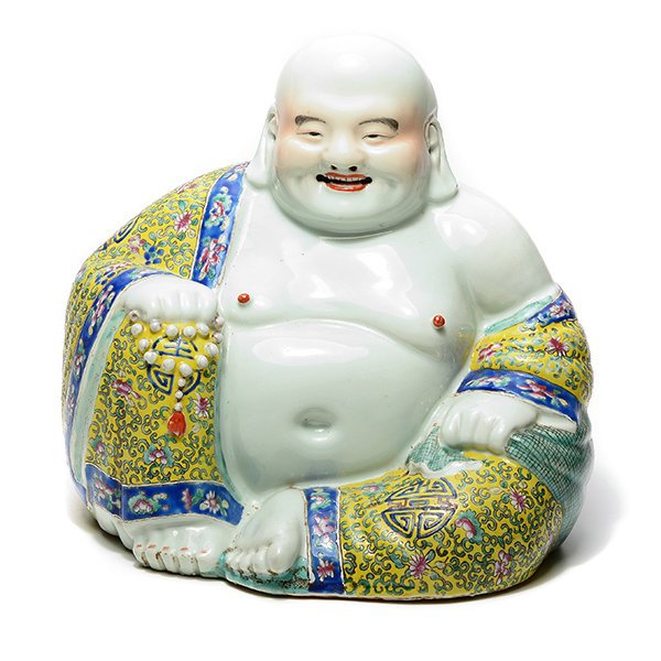 A Famille Rose Figure of Budai, Republic Period: A Famille Rose Figure of Budai The smiling figure wearing open robes and sitting with one knee propped up, his left hand holding a sack and his right a string of prayer beads, an impressed four-charac