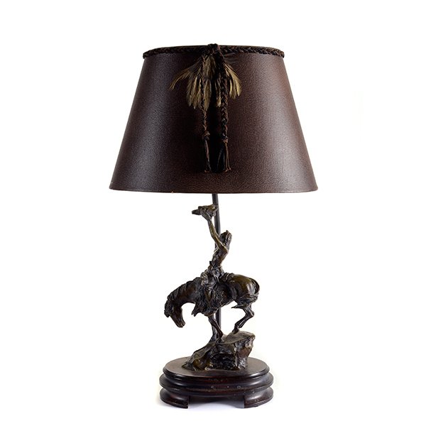 After Frederic Remington, Bronze Figure Mounted as a: After Frederic Remington (American 1861-1909), Bronze Figure of "The Mountain Man" mounted as a Lamp, with shade {Height to finial 21 inches}