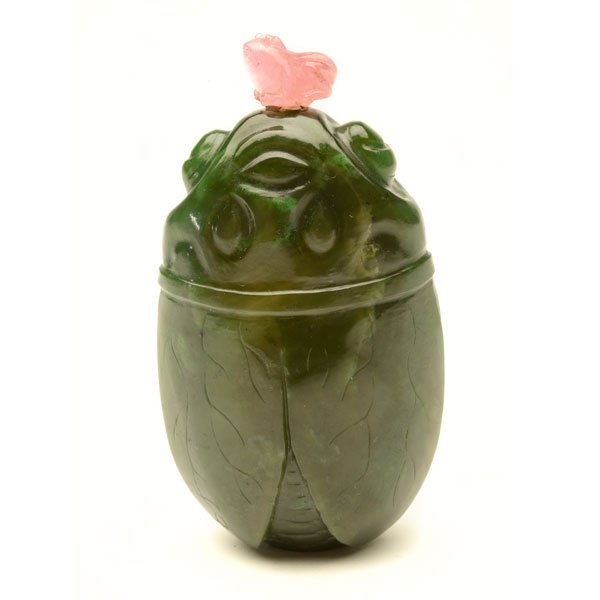 A Spinach Jade Snuff Bottle, Late 19th/Early 20th: A Spinach Jade Snuff Bottle The semi-translucent stone deeply carved in the shape of a resting cicada, with a rose quartz toad-form stopper. Late 19th/Early 20th Century {Height: 2 3/4 inches (7 cm) e