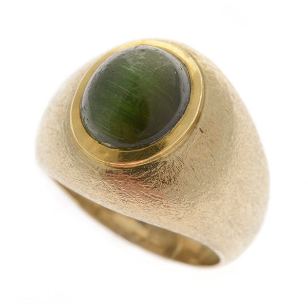 Cat's Eye Tourmaline, 18k Yellow Gold Ring.: Cat's Eye Tourmaline, 18k Yellow Gold Ring. Featuring one oval cat's eye tourmaline cabochon measuring approximately 10.7 x 9.1 mm, set in an 18k yellow gold, textured mounting. {Size 8, Gross Weight: