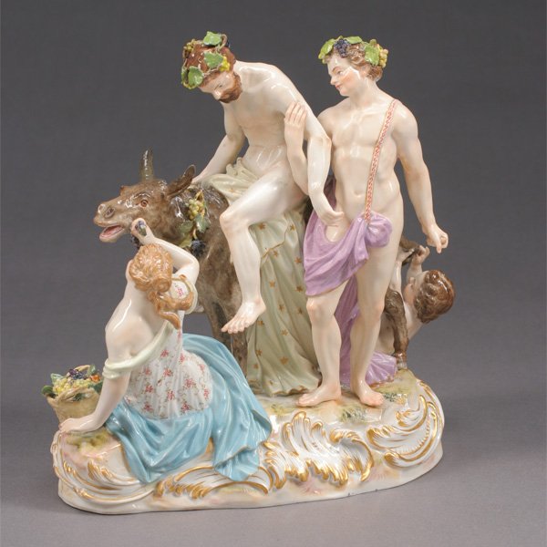 Meissen Porcelain Bacchanalian Figural Group: Meissen Porcelain Bacchanalian Figural Group. The Bacchanalian party modelled with a bearded man astride a donkey accompanied by a young man and a woman, with Meissen crossed swords mark in underglaze