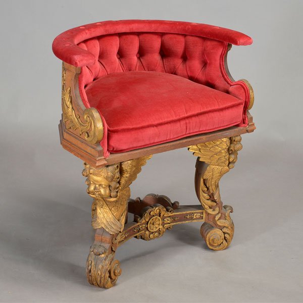 Renaissance Revival Carved Wood Chair: Renaissance Revival Gilt Heightened Carved Walnut Griotto Chair, with a tufted red velvet upholster seat, raised on cabriole tripod supports headed by winged cherubs, {Dimensions 29 x 26 x 17 inches}