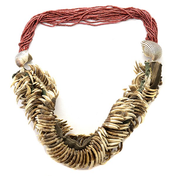 India Hill Tribes Teeth, Shell and Glass Necklace.: India Hill Tribes Teeth, Shell and Glass Necklace. A Kon necklace of antique carnivore teeth, Venetian cornaline d'Aleppo trade beads, seashells and brass bells, to be worn with teeth around the back 