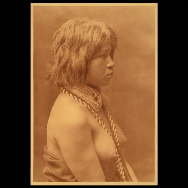 After EDWARD S. CURTIS "Judith-Mohave" Photogravure.: After EDWARD SHERIFF CURTIS (American 1868-1952) "Judith-Mohave" Photogravure. Sight: 16 1/4 x 10 3/4 inches; Frame: 24 1/4 x 18 1/4 inches. Printed title lower left inscribed l/r photogravure John An