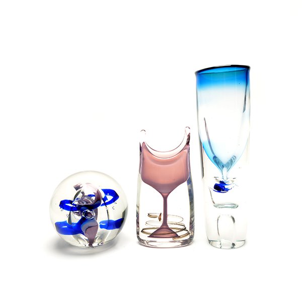 Two Floris Meydam Leerdam Unica Art Glass Vases and a: Two Floris Meydam Leerdam Unica Art Glass Vases and A Paperweight, # AM1356: Comprising a clear glass vase encasing a pink wine glass; a cylindrical vase with a blue shade rim and cushioned by two bub