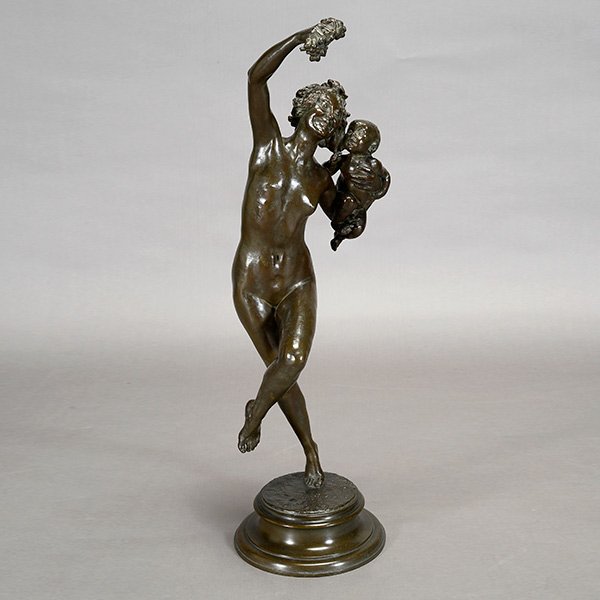 Frederick WM MacMonnies, Bacchante with Infant Faun: Art Nouveau Bronze Group: Bacchante with Infant Faun. The nude figure of young female, holding a ripe bunch of grapes in her left hand, holding a baby in the right arm, balancing on her right foot, in