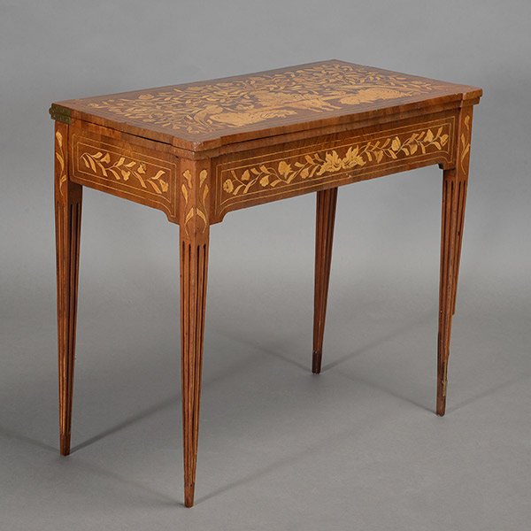 Continental Walnut Marquetry Card Table, opening to: Continental Walnut Marquetry Card Table, opening to reveal tromp l'oeil four cards in corners, with fluted tapered legs 19th Century {Dimensions 28 x 31 1/2 x 15 1/2 inches} [Repaired leg]