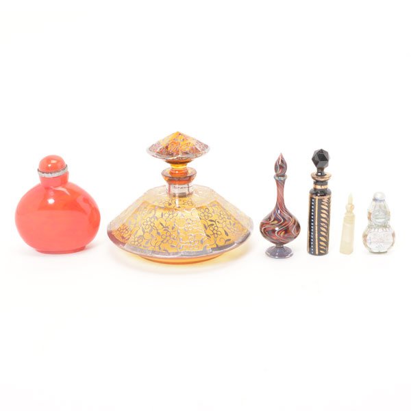 Five Art Deco Perfume Bottles and a Snuff Bottle: Five Art Deco Perfume Bottles and a Snuff Bottle, Comprising one amber glass bottle with silver overlay {height 4 1/4 inches}, four smaller bottles including a mother-of pearl, a blown glass, a black
