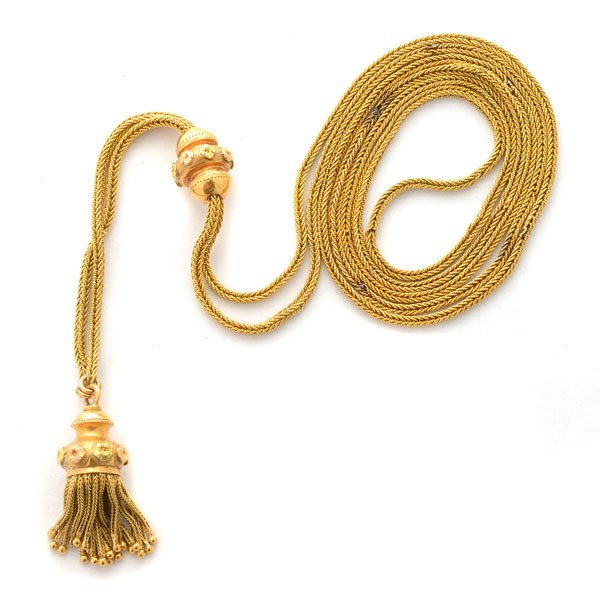 French 18k Yellow Gold Sautoir.: French 18k Yellow Gold Sautoir. The 18k yellow gold fancy continuous link featuring an 18k yellow gold slide with floral motif, terminated by a matching 18k yellow gold floral motif tassel, forming a 